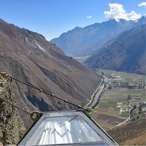 A view of a valley from a high vantage point. Description generated by AI