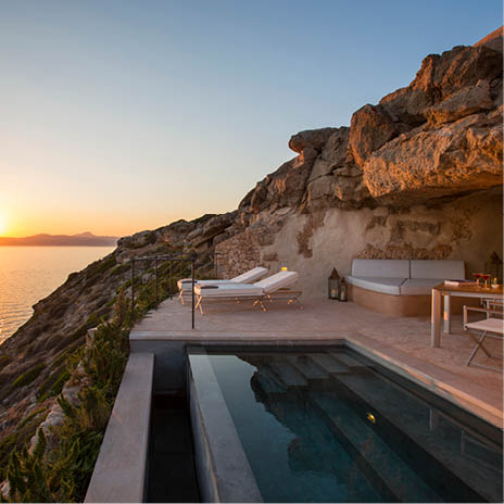 A large pool with a sunset in the background. Description generated by AI
