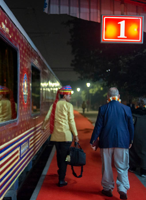 A train with a red and blue striped design. Description generated by AI