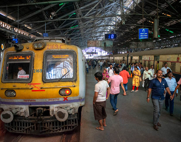 A yellow train at a train station. Description generated by AI