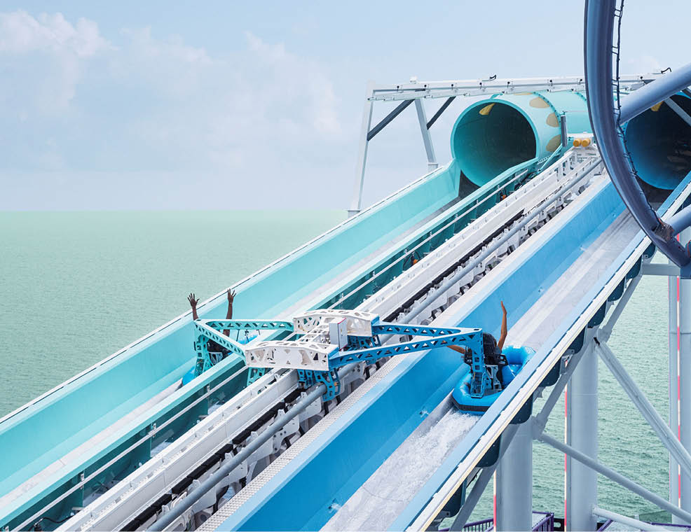 A blue roller coaster with a tunnel. Description generated by AI