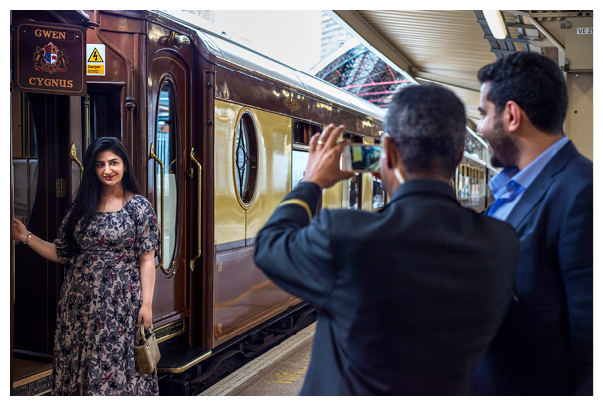 Passengers taking photos in the Belmond British Pullman luxury train stoped at London Victoria train station.   Belmond British Pullman is a private luxury train that operates day and weekend journeys around Britain and also conveys passengers of the Venice Simplon-Orient-Express VSOE between London and Folkestone, as part of their journey to Venice and other European cities.