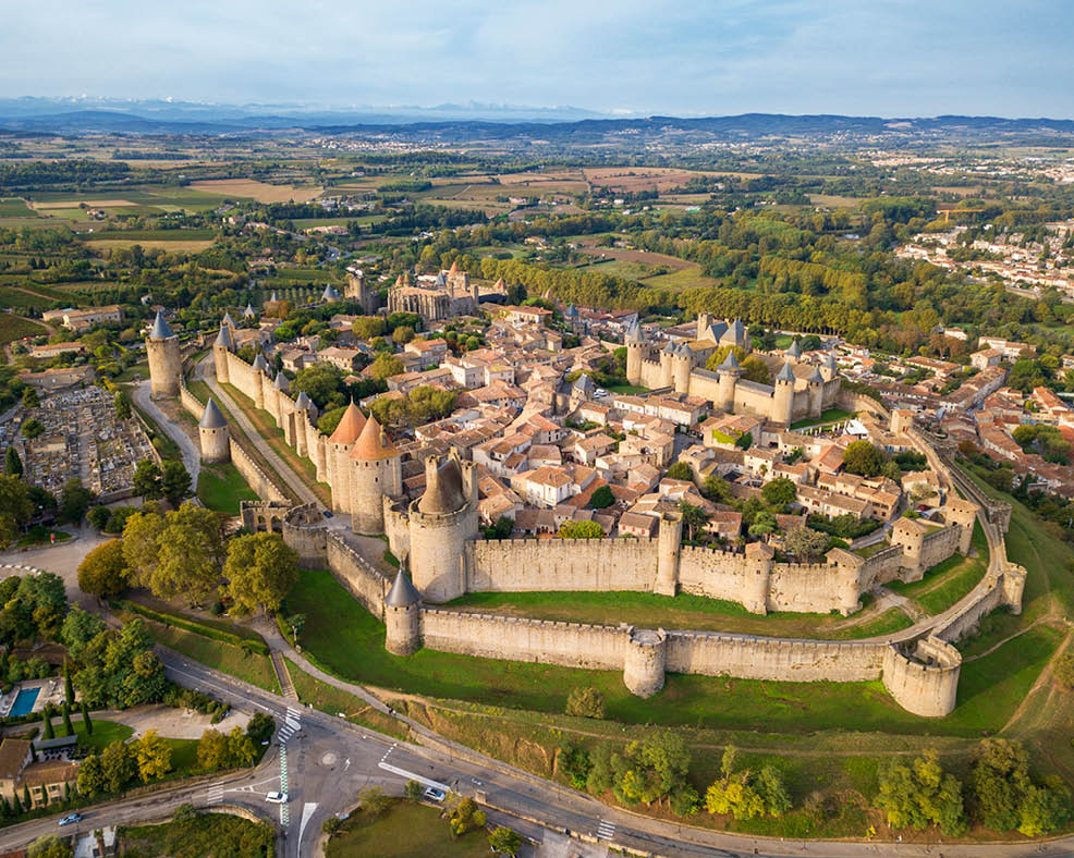 Aerial view of Cite de Carcassonne, a medieval hill-top citadel in the French city of Carcassonne, Aude, Occitanie, France.