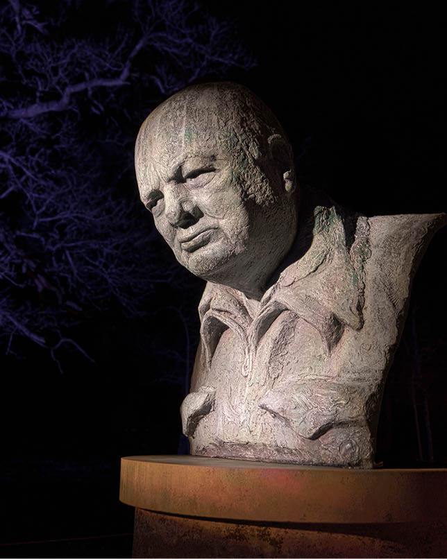 Blenheim Palace, Woodstock, Britain - 12.30.2023: The mysterious statue of Winston Churchill in the night evokes a sense of mystery. Ideal for mystery, history and art concepts