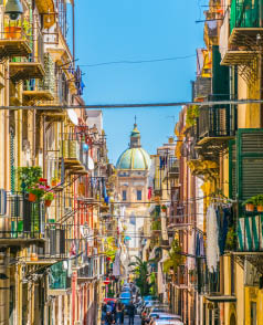 View of a narrow street leading to chiesa del carmine maggiore in Palermo, Sicily, Italy 