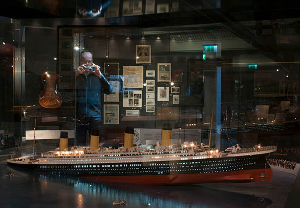Inside Titanic Belfast museum and Visitors Centre, Titanic Quarter, Belfast, Northern Ireland, UK. Titanic Belfast Experience. The building is clad in metal shards and when the light plays on them it looks like the movement of water. From above, the building resembles a white star, the symbol of Titanic’s operators. 