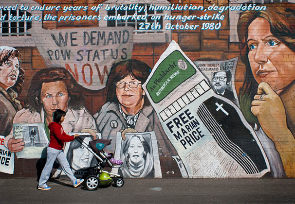 Free Marian Price wall in Falls road street, Belfast, Northern Ireland, UK. We Demand POW Status Now. “Forced to endure years of brutality, humiliatioon, degradation and torture, the prisoners embarked on hunger-strike, 27th October 1980". Falls Road Belfast, Northern Ireland International Wall, Falls Road, Belfast The subjects change with the exception of Guernica. LIkewise "Free Marian Price" has been added to all the paintings with the exception of Guernica. As one of the so-called "Price sisters", Price was jailed for her part in the IRA London bombing campaign of 1973. 