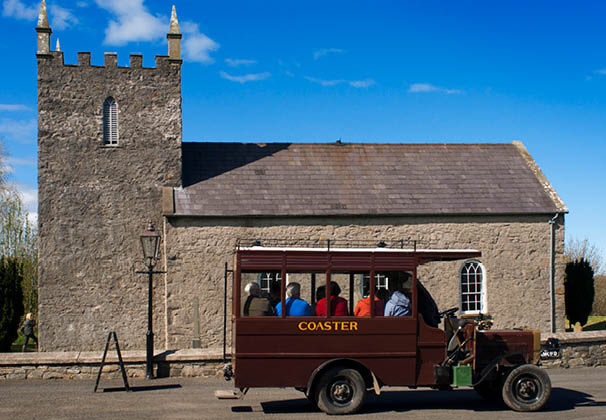 Ulster Folk and Transport Museum, Ballycultra town, Belfast, Northern Ireland, Britain, UK. Church of Ireland At the time Kilmore Church was built in 1790, the Church of Ireland was still the Established Church in Ireland, and was supported by tithes. This 10 per cent payment of the annual produce of land or labour was made to the church by the entire population, whether they belonged to it or not. This small Anglican (Protestant Episcopalian) church was built to accommodate 160 people, although parish records show the usual attendance was about 100 worshippers.