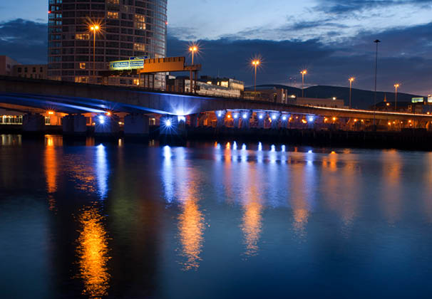 The M3 Cross harbour bridge over the River Lagan Belfast, Northern Ireland, UK. One of the bridges in the center of Belfast over the River Lagan. The River Lagan (from Irish: Abhainn an Lag in meaning “river of the low-lying district"; Ulster Scots: Lagan Watt r) is a major river in Northern Ireland which runs 40 miles (60 km) from the Slieve Croob mountain in County Down to Belfast where it enters Belfast Lough, an inlet of the Irish Sea.