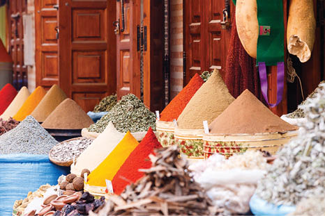 Colorful cooking Spices and flower in traditional local medina bazaar market in Marrakesh, Morocco