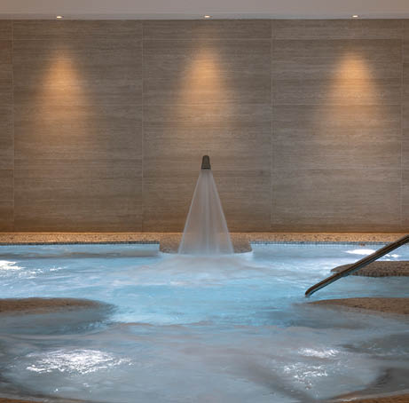 A nude figure is standing in a bathroom, next to a bathtub. AI generated content