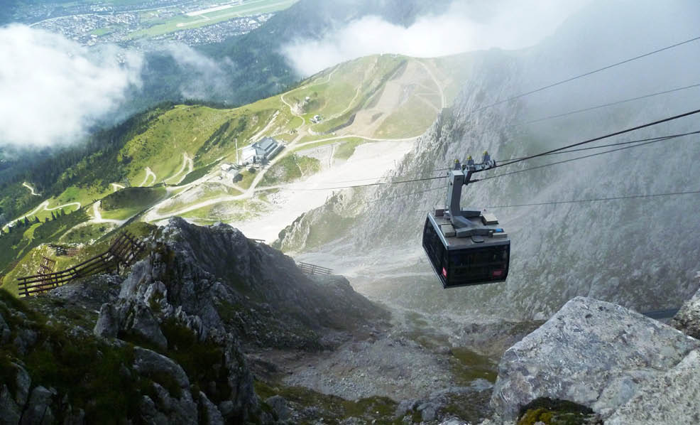 A cable car is traveling down a mountain, carrying passengers to a ski resort. AI generated content