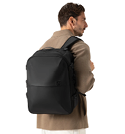 A man wearing a brown jacket and carrying a black backpack. AI generated content