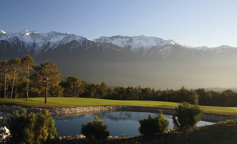 A large body of water with a mountain in the background. AI generated content