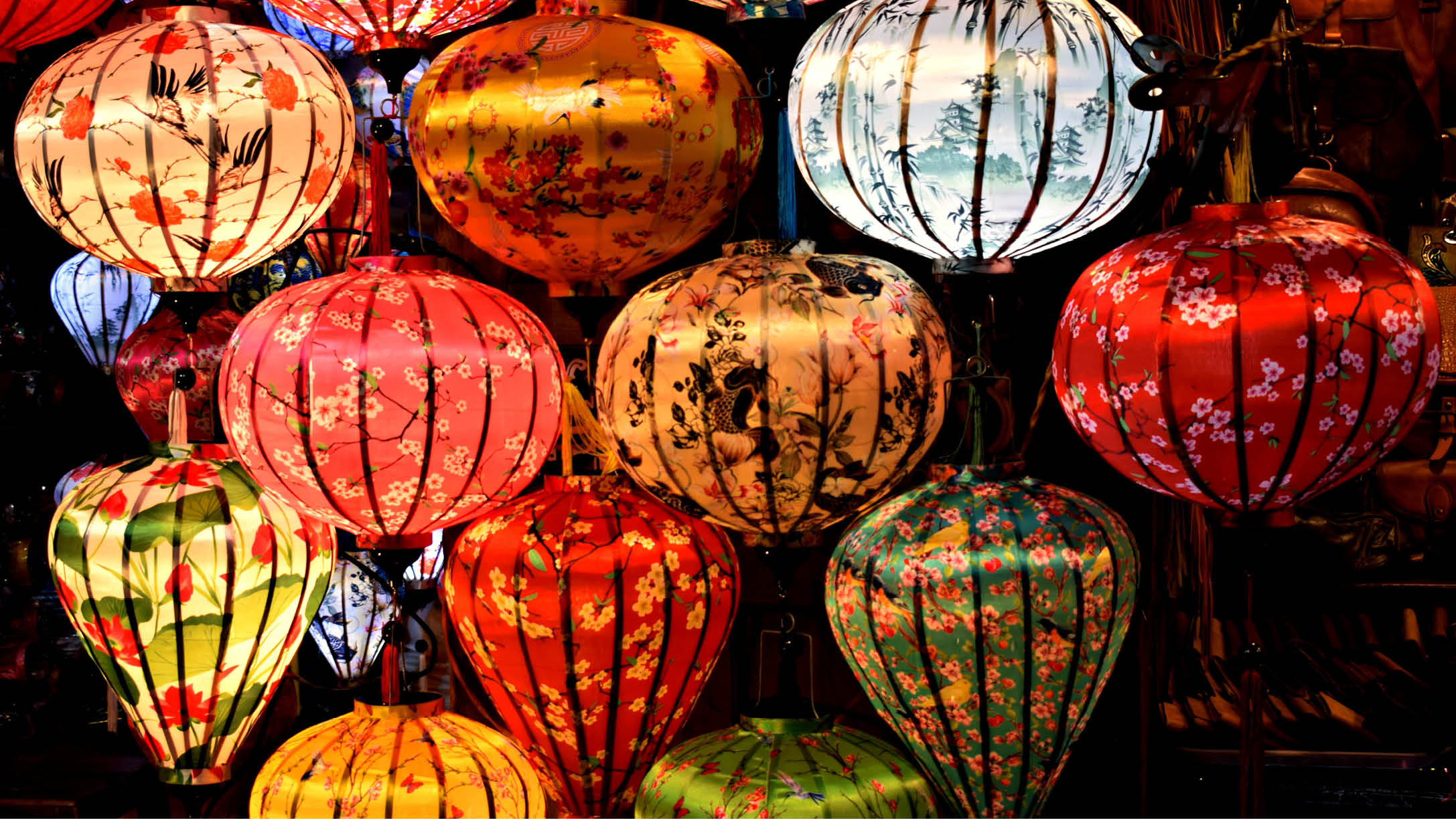 A collection of colorful lanterns hang from the ceiling, creating a vibrant and lively atmosphere. AI generated content