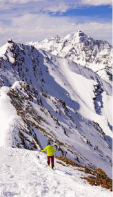 Man Hiking In High Altitude Extreme Snow Mountain Peaks