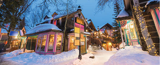 Breckenridge, Colorado, USA downtown streets at night in the winter with holiday lighting 