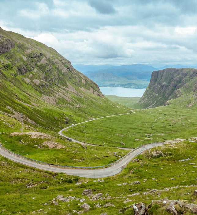 Driving the Bealach na Ba single track scenic road from Applecross. View from the pass in North West Highlands, Scotland, UK