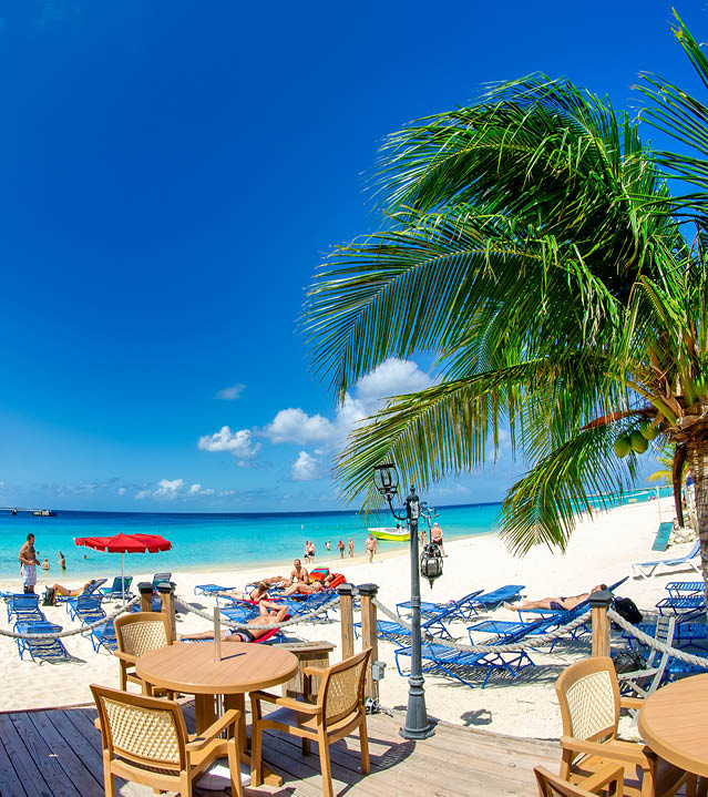 Turks and Caicos - February 22, 2012: A beautiful caribbean beach with tourists.