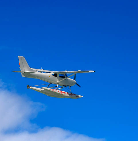 Beautiful tropical summer landscape with seaplane for guided tours along the Indian Ocean coast, Mauritius