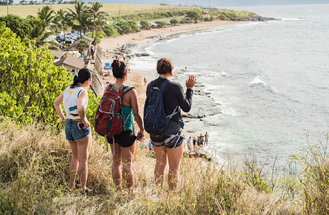 Friends looking down to Hookipa Beach, Maui, Hawaii