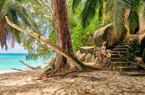 Three year old toddler boy on beach with mother. Summer family vacation at at Seychelles, Mahe.